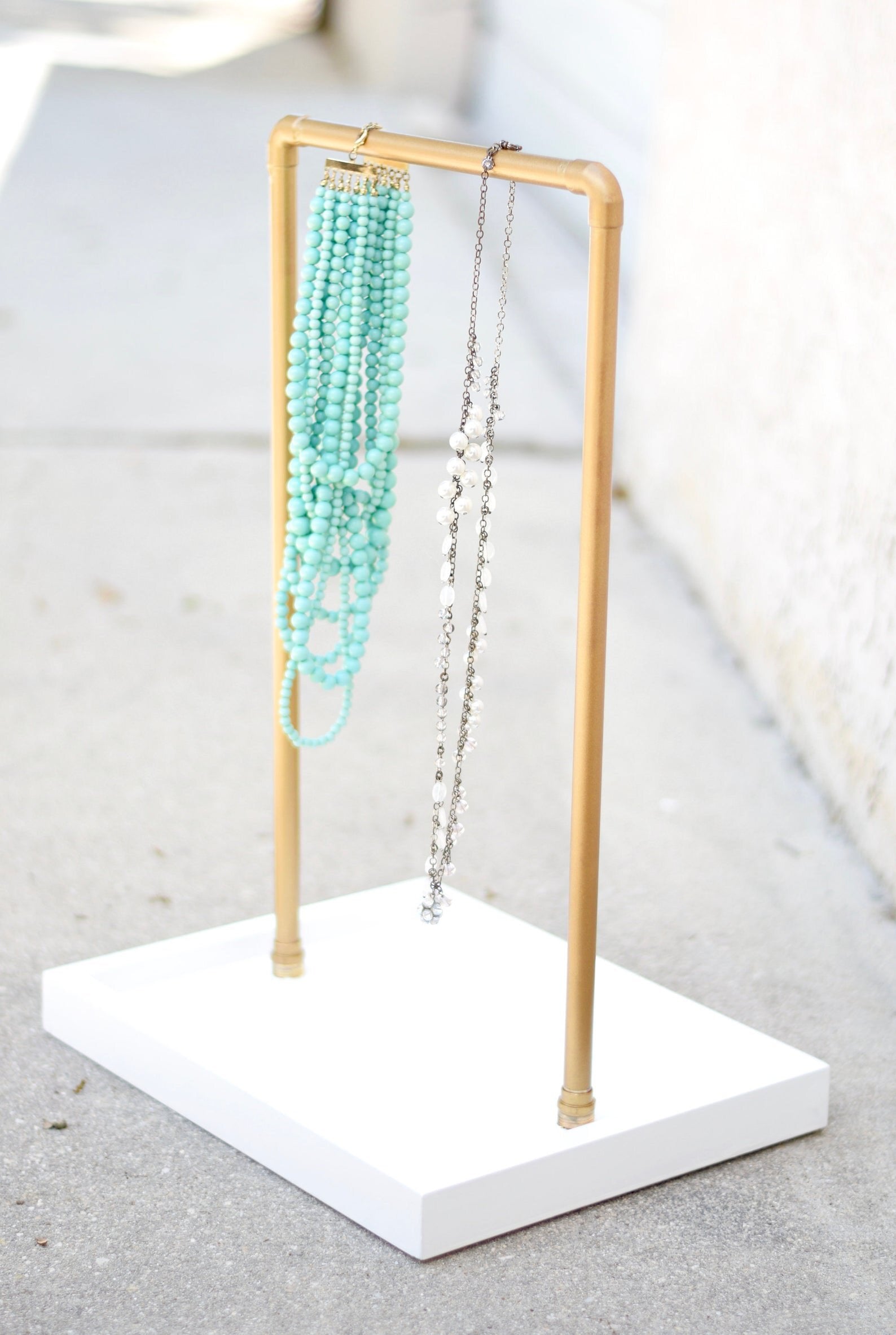 Gold and White Necklace Display Bar