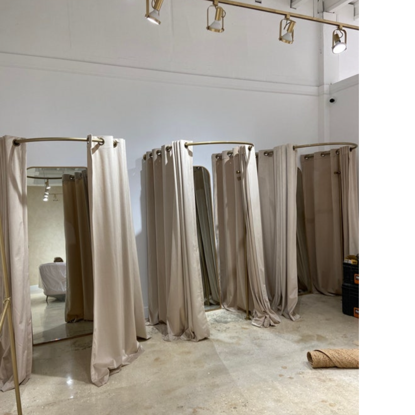 Curved fitting room curtain rods